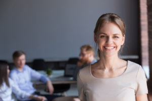 Woman in meeting - representing 'what exactly is human resources management' concept