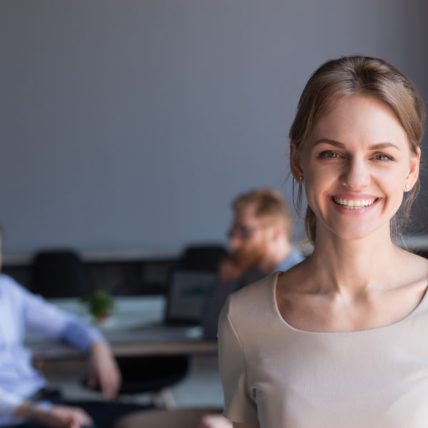 Woman in meeting - representing 'what exactly is human resources management' concept